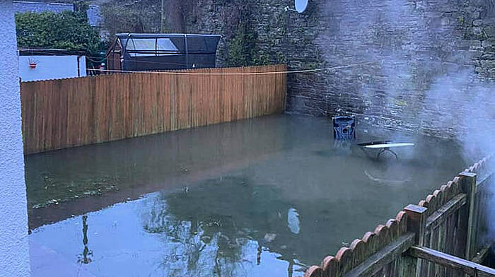 Bandon gardens flooded with sewage after downpour Image