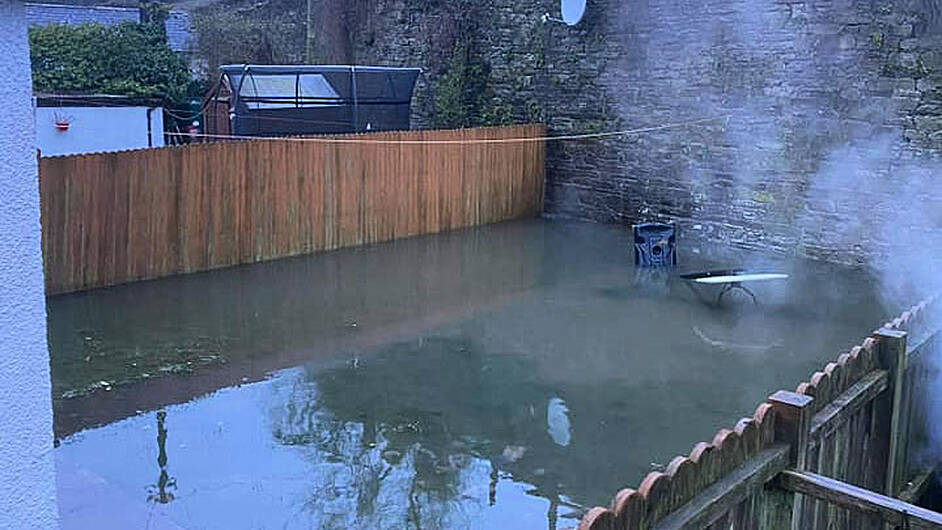 Bandon gardens flooded with sewage after downpour Image