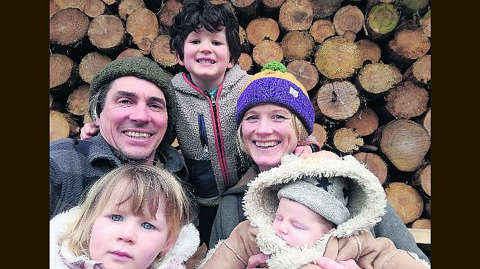 Dee and Bradley with Wren, Cuan and baby Féda, who was born at home in front of the fire!