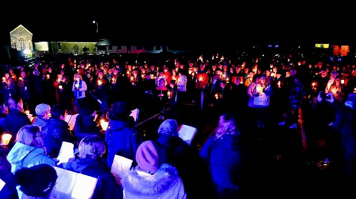 WATCH: The names of 250 locals lost during the pandemic are read aloud a candlelit vigil in Skibbereen Image