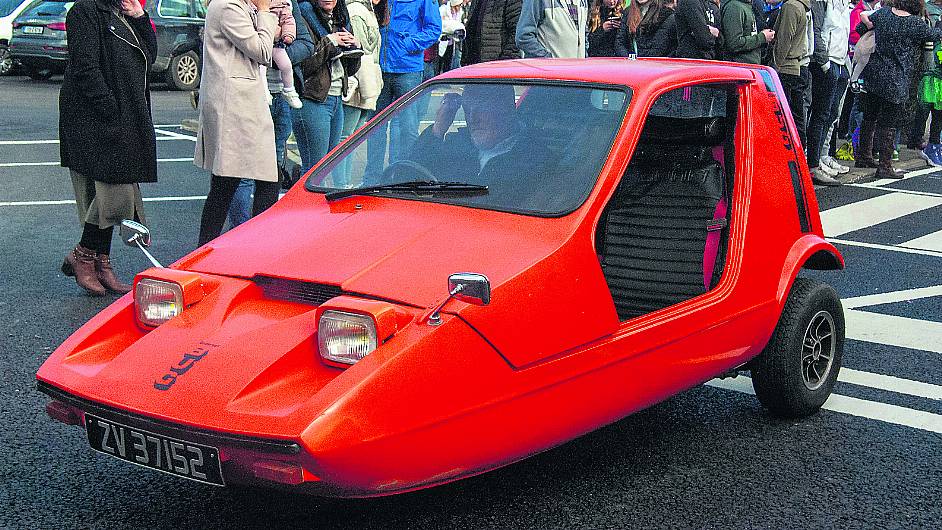 Ken snug in his beloved tangerine bug Image