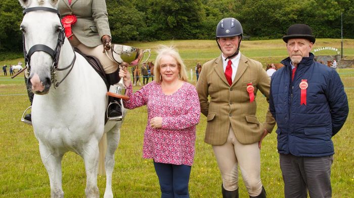 Sinead Barry, Rosscarbery ,winner in the Ridden Irish Draught class at Dunmanway show,  receiving the Mick Carroll Perpetual  Memorial Cup from Chrissie O'Mahony with judges Conor Wixted and Gary Guyatt. Photo: George Maguire