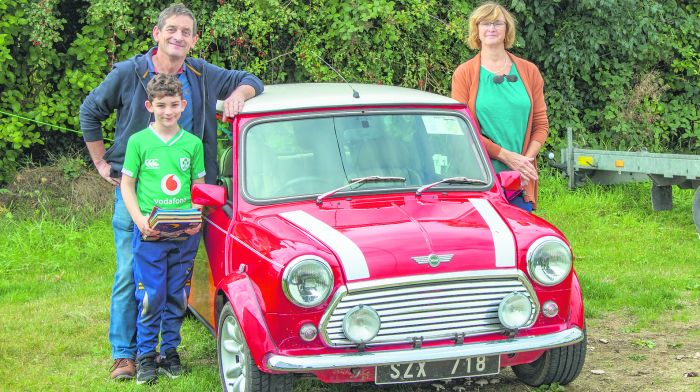 ictor and Susan Beamish with their grandchild Conor about to set off on the Irish Mini Owners’ Club run from Timoleague to tour West Cork. 								           		             
(Photo: Gearóid Holland)