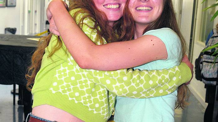 Eva Crowley and Anna Pearce, celebrating at Kinsale Community College. (Photo: Denis Boyle)