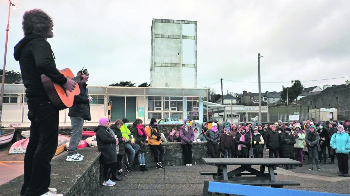 Musician Mick O'Callaghan performs during the vigil in Schull. Photo by Carlos Benlayo