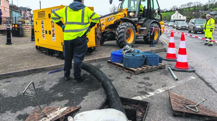 Bantry, West Cork, Ireland. 17th Feb, 2022. Cork County Council employees were putting out pumps this evening in preparation for Storm Eunice, which will hit Ireland at 3am Friday morning. Met Éireann has issued a Red Weather Warning for wind, with gusts of up to 130KMH expected. Picture: Andy Gibson.