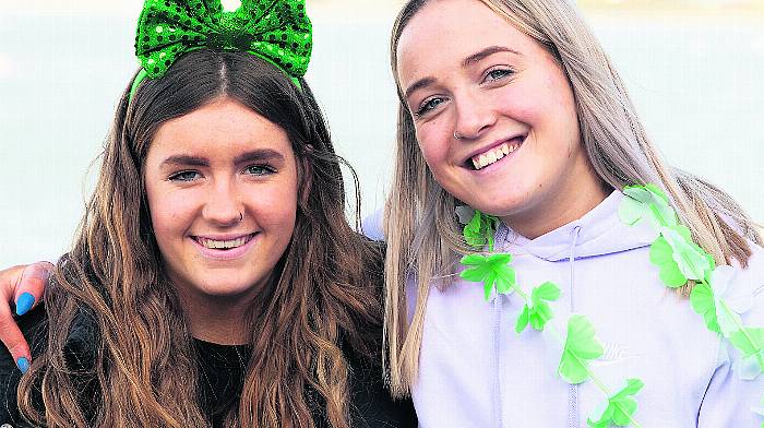 Fiadh Malone, Farran (left) and Lola O’Donnell at the parade in Courtmacsherry.  Right: in Coppeen were Moya Hennessy, Lauren O'Mahony, Aoife Hennessy and Marie O'Mahony. (Photo: Martin Walsh & Denis Boyle)