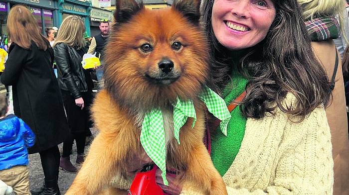 Laura Dunne in Schull; left: Rosita Kingston from Baltimore and her dog Rufus enjoying the parade in Skibbereen; right: William and Adele O’Regan from Cambridge receiving their St Patrick’s Day cards from Skibbereen. (Schull photo: Carlos Benlayo)