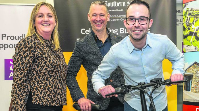 Skibbereen,. West Cork, Ireland. 6th Dec, 2022. The Southern Star West Cork Busness Awards pitch night was held in AIB, Skibbereen on Tuesday evening. Jean Farrelly, Aiden Hennessy and David Kingston of Hennessy Outdoor/Kruz with their Belize Electric Foldable Bike. Photo: Andy Gibson.