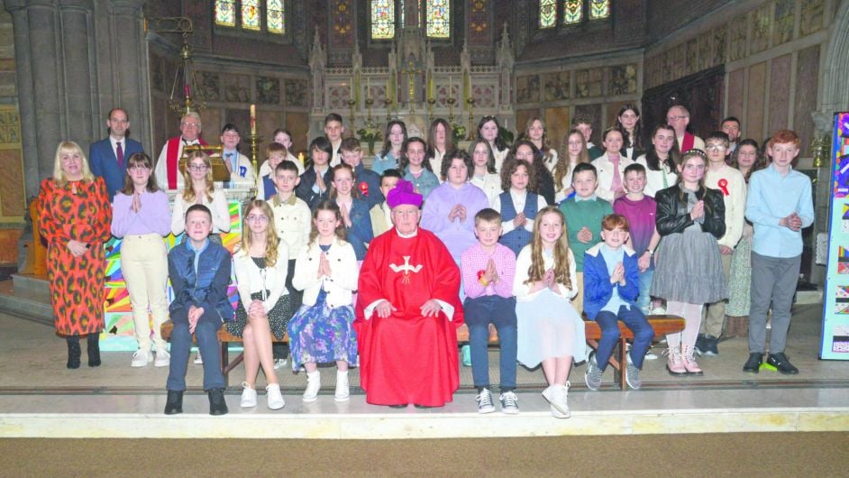 Gaelscoil Dhroichead na Banndan students making their confirmation in St Patrick’s Church in Bandon with Monsignor Kevin O’Callaghan.										     (Photo: Denis Boyle)