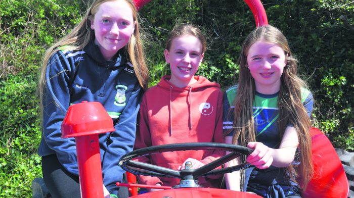 Alannah O'Driscoll, Neasa Daly and Lucy O'Driscoll at the Rath Vintage Club annual run near Baltimore. Left: Henry Vins and Stephen Reilly on their way through Skibbereen after warlking from the Viaduct  with 60lbs on their backs in memory of Drimolegue teenager Ricky Barrett and to raise funds for Aoibheann's Pink Tie charity. (Photos: Anne Minihane)