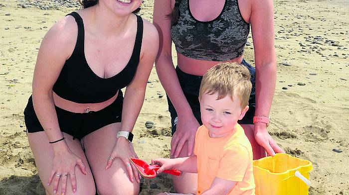 Enjoying the sun in Garrettstown were Emily Armstrong and Caroline Condon and their nephew Charlie Crowley. (Photo: Denis Boyle)