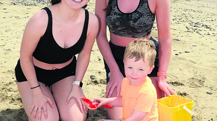 Enjoying the sun in Garrettstown were Emily Armstrong and Caroline Condon and their nephew Charlie Crowley. (Photo: Denis Boyle)