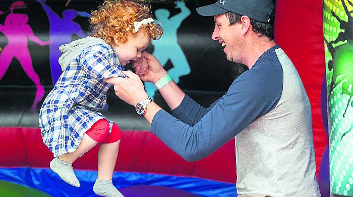 Amy Carroll (2) and dad Wayne Carroll from Dunderrow enjoying the bouncy castle at the Riverstick Festival.
(Photo: John Allen)