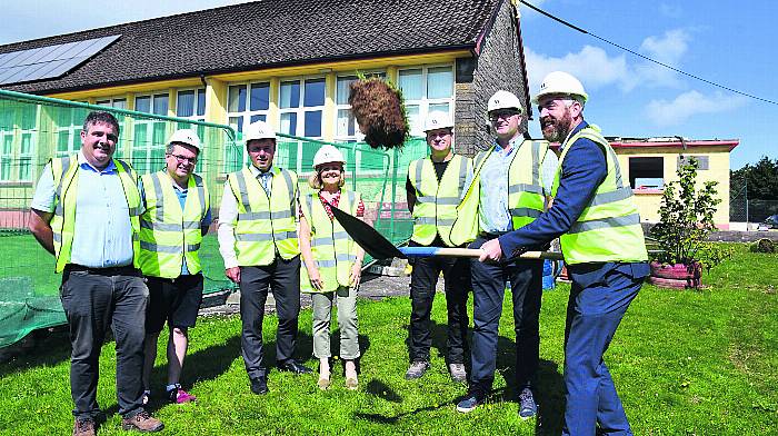 FLIPPIN’ GREAT: West Cork TD Christopher O’Sullivan turned the sod on the new €1.2m extension for Drinagh National School by Walsh Construction watched by Declan Daly (Concept Design Engineers), Don Hurley (Drinagh NS board of management), Dominic Hayes (Drinagh NS principal), Nora 
Perkins (Drinagh NS vice-principal), Kevin O’Connell (foreman), and  Donal Walsh (Walsh Construction). (Photo: Anne Minihane).