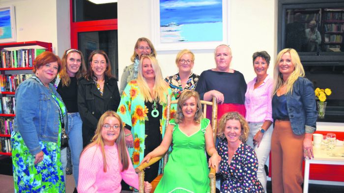 Artist Maeve O’Neill surrounded by her friends at the opening of her exhibition ‘To The Sea’ at Skibbereen Library last 
Friday evening. The exhibition runs from September 15th to October 21st. (Photo: Anne Minihane)