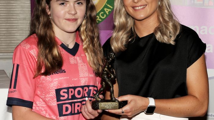 Laura O'Mahony presents the U13A Drinagh Co-op Player of the Match award to Hannah Deasy, Kinsale.