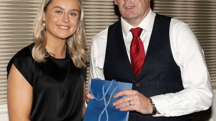 Paul O'Callaghan, West Cork LGFA Treasurer, makes a presentation to special guest Laura O'Mahony.