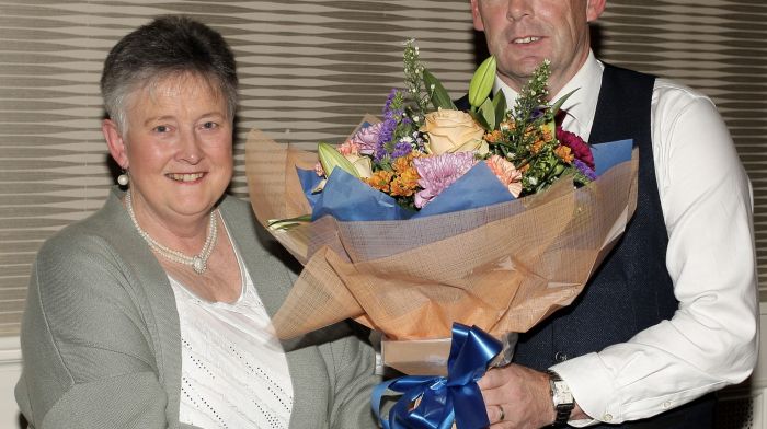 Paul O'Callaghan, treasurer of West Cork LGFA presents a bouquet of flowers to Marian Crowley, treasurer of LGFA Cork County Board.