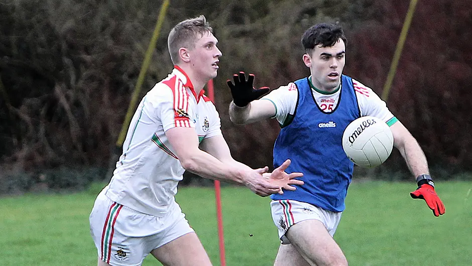 Team A's captain Sean White is challenged by team D's captain David Lowney during the Padraig Griffin Memorial Tournament at Ahamilla. (Photo: Paddy Feen)