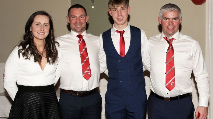 Former Cork football goalkeeper Martina O'Brien presents the 2022 South West JAHC medals to Ricky O'Flynn, Eoghan O'Driscoll and Ryan O'Flynn.