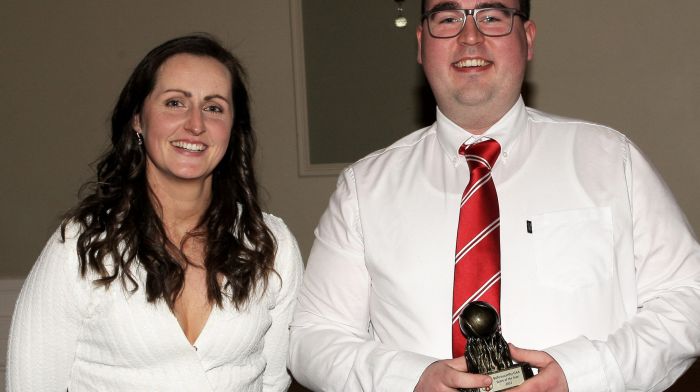 Martina O'Brien presents the Score of the Year trophy to Andrew O'Flynn.