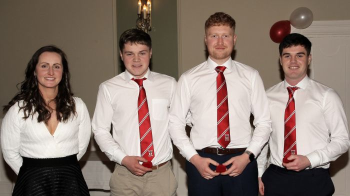 Martina O'Brien presents the 2022 SW junior A hurling championship medals to Connall Cullinane, Ciaran Nyhan and Padraic Cullinane.