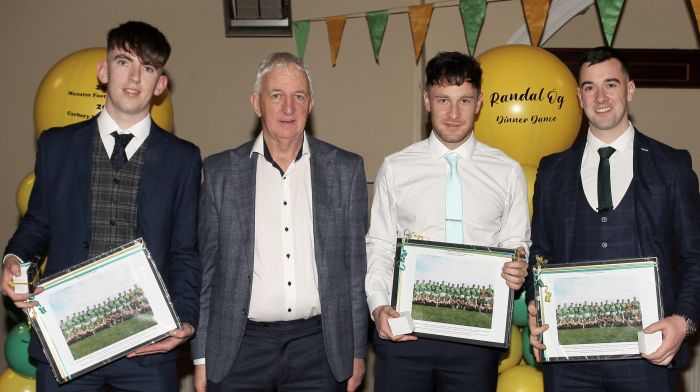 Conor Counihan presenting medals to Barry O'Driscoll, Conor O'Neill and Stephen Crowley.