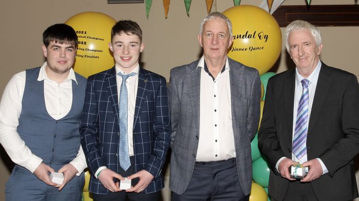 Project Co-Ordinator Cork Football, Conor Counihan, presenting medals to Tony O'Neill, Sean Calnan and Patrick Collins.