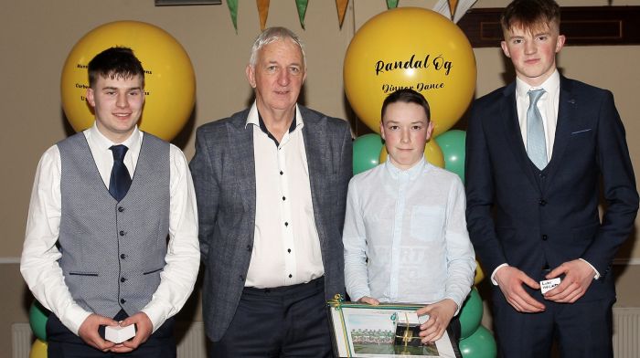 Project Co-Ordinator Cork Football, Conor Counihan, presenting medals to Danny O'Donovan, Jack Coakley and Luke McCarthy.