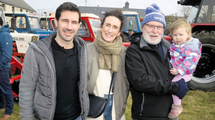 Supporting a tractor run in Ahiohill for Drimoleague and Bandon food banks were Liam Suipéal, his grandaughter Cara, and her mum and dad Conor and 
Caoimhe O’Driscoll. (Photo: Denis Boyle)