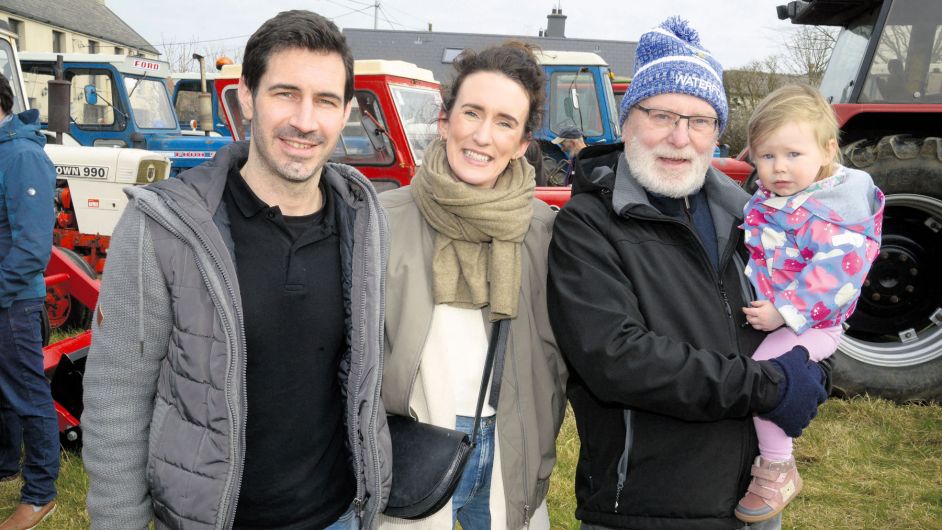 Supporting a tractor run in Ahiohill for Drimoleague and Bandon food banks were Liam Suipéal, his grandaughter Cara, and her mum and dad Conor and 
Caoimhe O’Driscoll. (Photo: Denis Boyle)