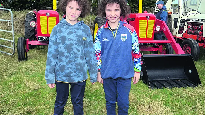 At a recent tractor run in Ahiohill  in aid of Feed West Cork Food Banks in Drimoleague and Bandon were twins Jack and Declan Corcoran from Crookstown.	                      (Photo: Denis Boyle)