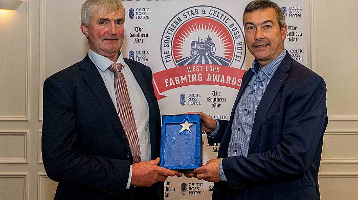 Ronald Shorten collects the August award presented by Stephen Rowe of AIB, Clonakilty.