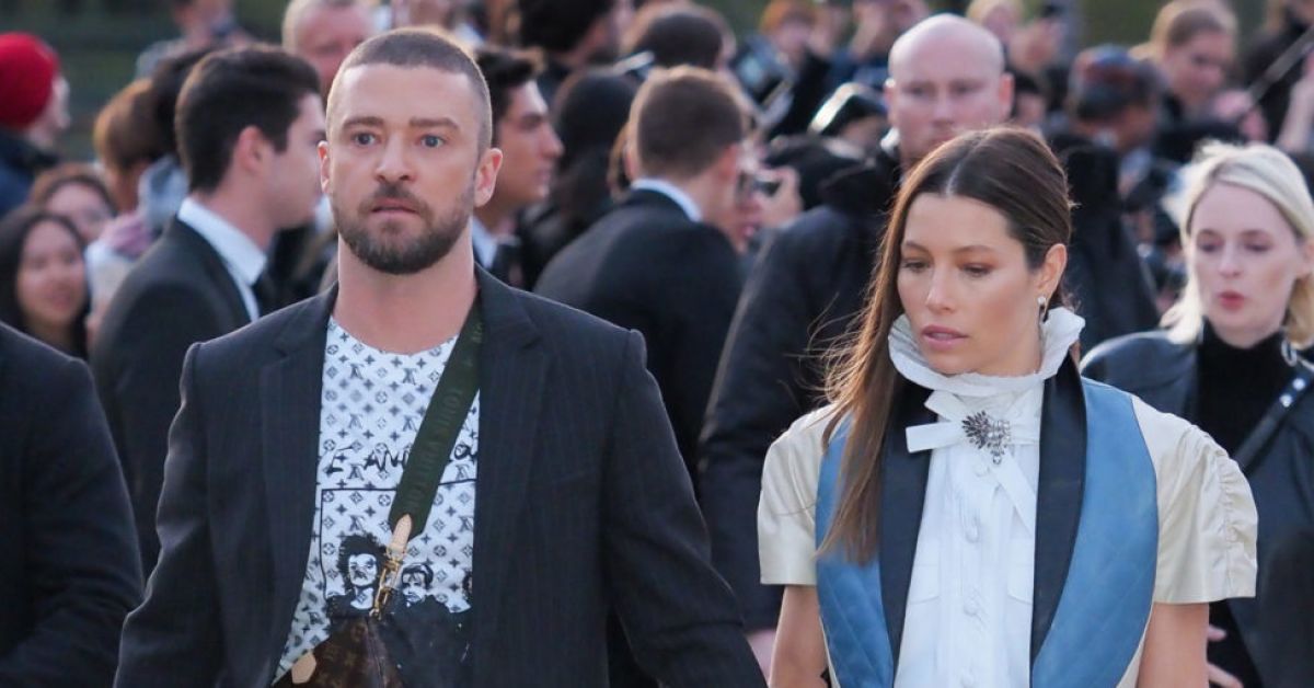 Justin Timberlake is TACKLED by a man who grabs his leg after he arrived to Louis  Vuitton show