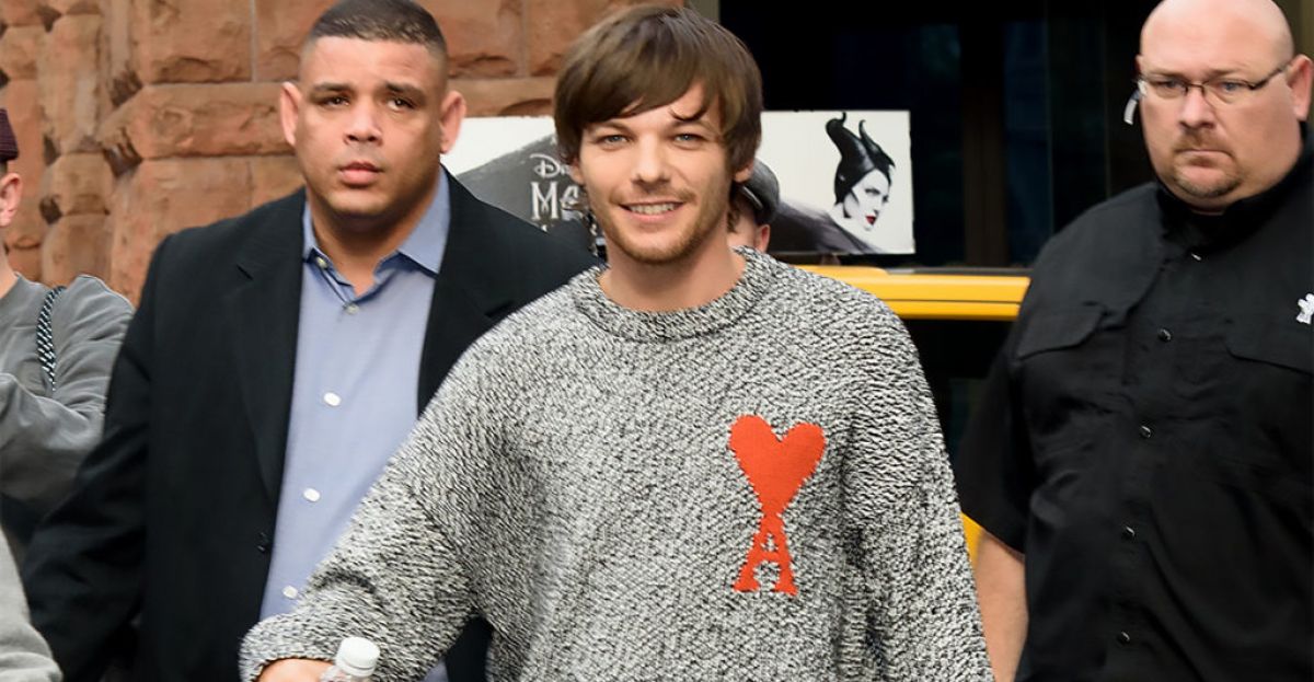 Louis Tomlinson lets his hair down in Manchester after splitting