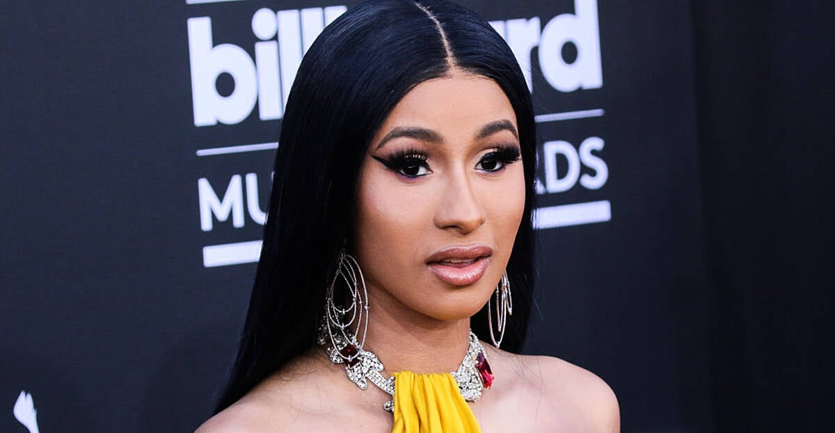 LOOK: Cardi B Shows Off New Lip & Chest Piercings | SPIN1038