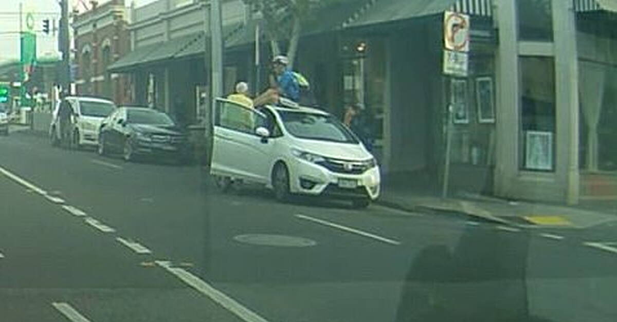 Video: Cyclist lands safely on roof of car after being taken out by ...