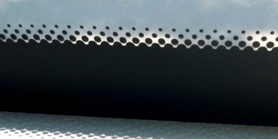 The Real Reason Your Car Windshield Has Those Small Black Dots
