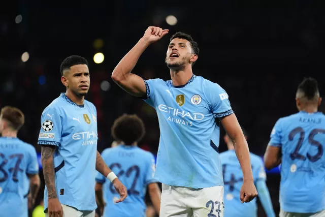 Matheus Nunes points to the sky after scoring for Manchester City 