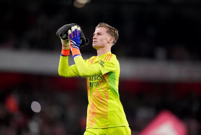 Jack Porter, with a towel in his hands, claps the Arsenal fans before the game against Bolton