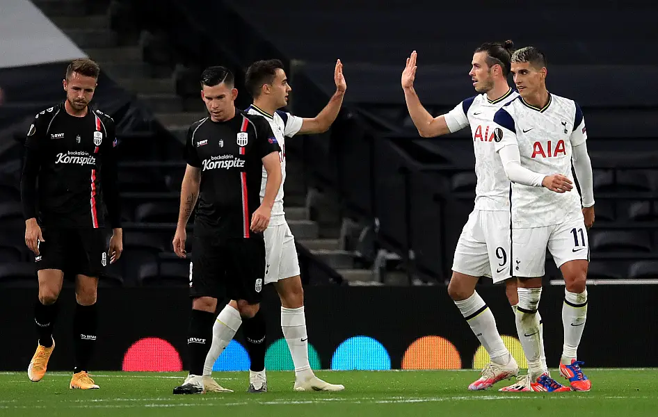 Gareth Bale, second right, high-fives Sergio Reguilon after setting up a goal against LASK