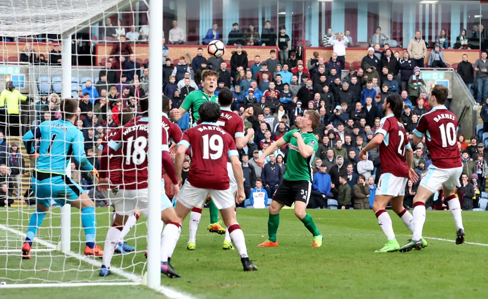 Sean Raggett, top, heads Lincoln's fifth-round winner against Burnley in 2017