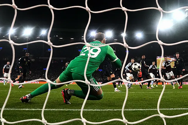 Ollie Watkins attempts a shot on goal which is saved by Juventus goalkeeper Michele Di Gregorio