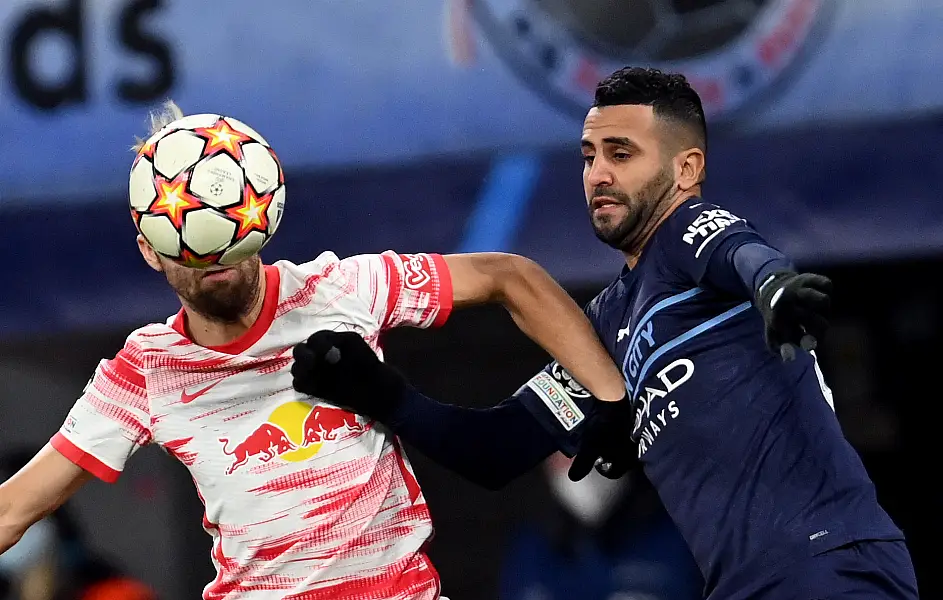 Riyad Mahrez battles for the ball