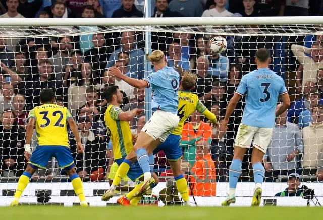 Erling Haaland heads in his third goal of the game