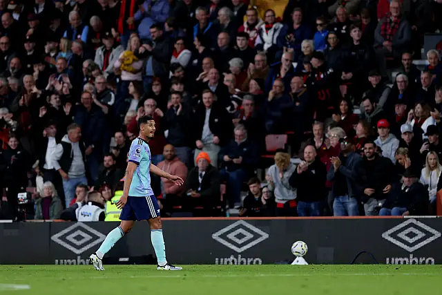 Arsenal defender William Saliba walks off the pitch after receiving a red card against Bournemouth