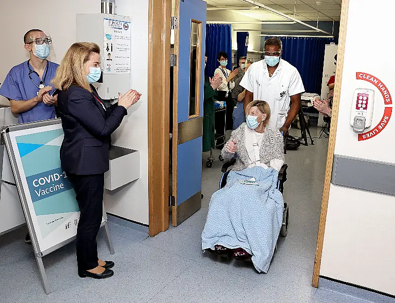 Annie Lynch (centre right), 79, is the first person to receive a coronavirus vaccine in Ireland