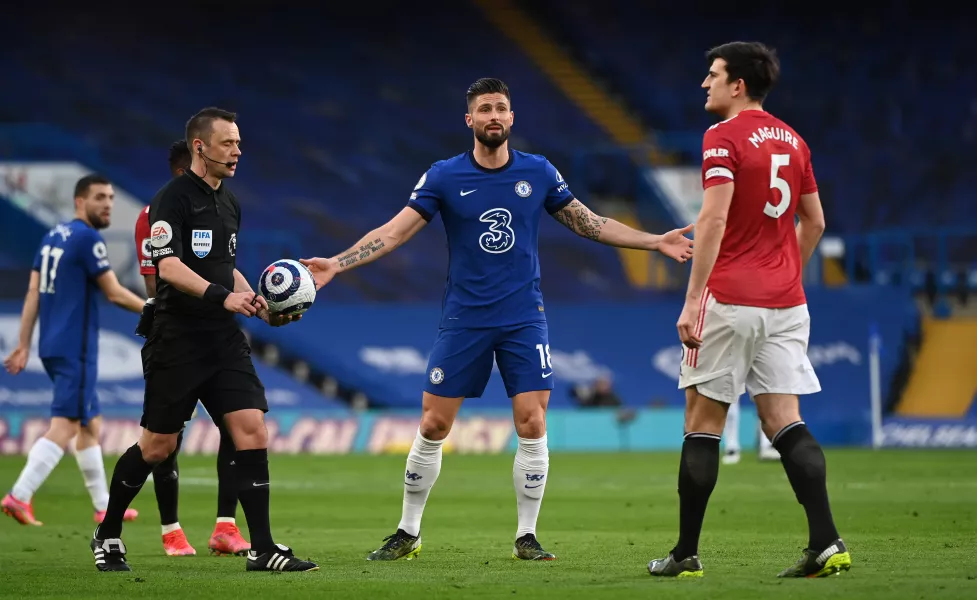 Chelsea’s Olivier Giroud remonstrates with Harry Maguire 