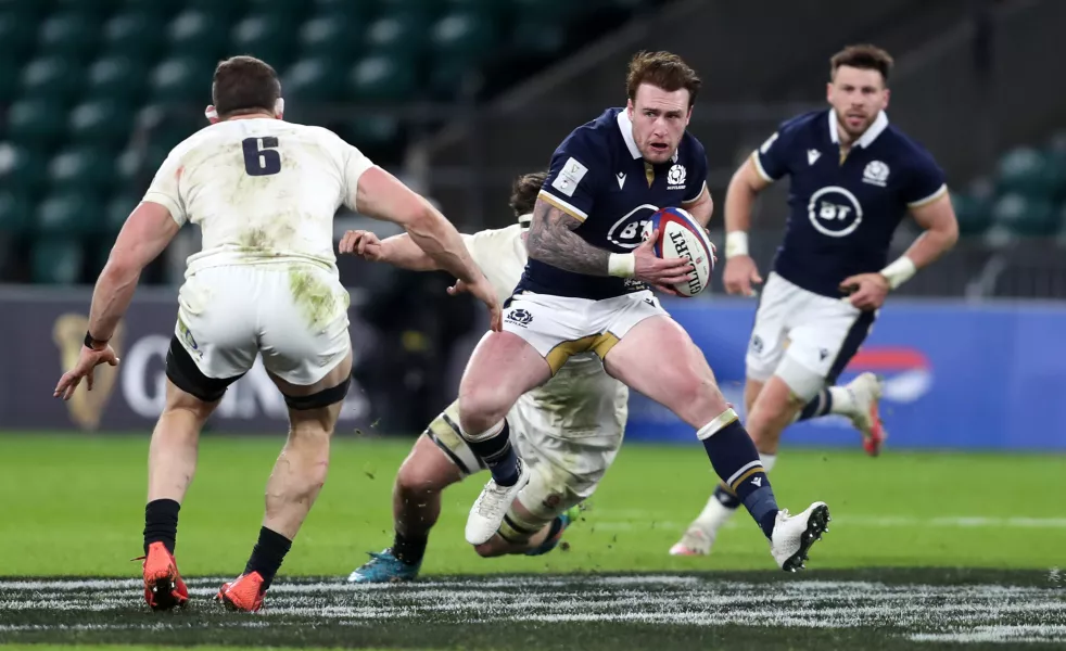 Scotland’s Stuart Hogg breaks past England’s Mark Wilson